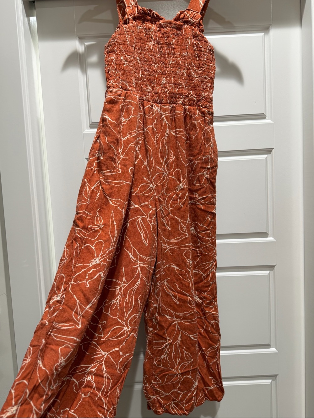 Maurices Rust Orange Floral Smocked Jumpsuit